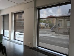 dark roller blinds on a store window